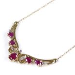 A 9ct gold ruby and diamond pendant necklace, on 9ct chain, pendant 33.9mm across, necklace length