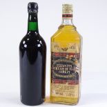 A bottle of Stewarts Cream of the Barley blended Scotch Whisky, and a bottle of Warres 1970 LBV Port