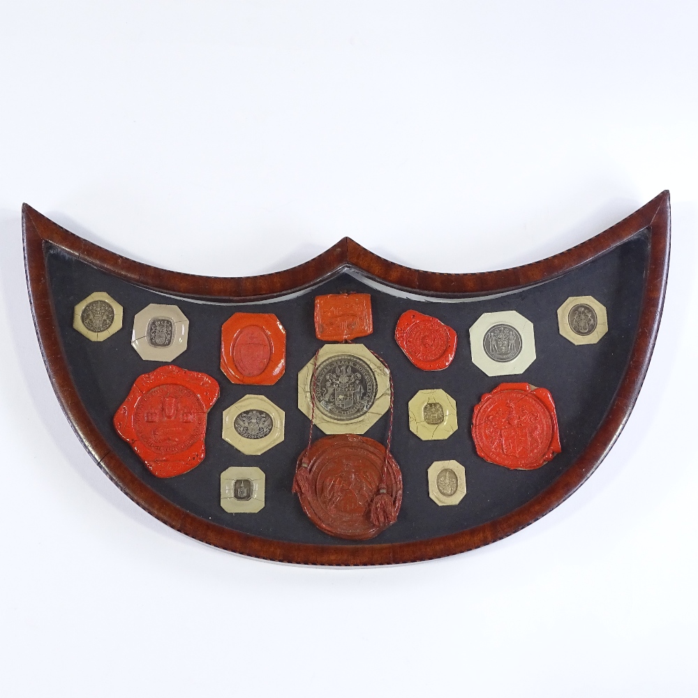 A 19th century banded mahogany shield-shaped frame containing wax seals, width 41cm - Image 2 of 3