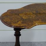A Victorian burr walnut stretcher table with shaped top, on carved base, length 90cm