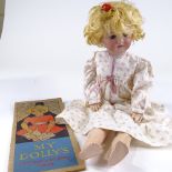 An Armand Marseilles 390 bisque-headed doll, with blue sleep eyes and composition body, together