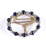 An 18ct gold sapphire and diamond oval brooch, length 25.3mm, 5g