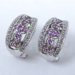 A pair of 14ct white gold pink sapphire and diamond earrings, pierced settings with security clip,