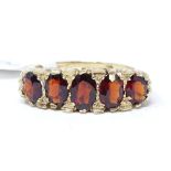 A 9ct gold 5-stone garnet ring, setting height 7.1mm, size M, 3.6g