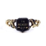 A Victorian 18ct gold black enamel mourning ring, with "In memory of" plaque, pierced foliate