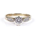 A 9ct gold solitaire diamond ring with diamond set shoulders, total diamond content approx 0.3ct,
