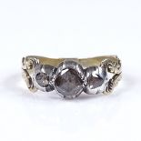 An Antique 3-stone rose-cut diamond ring, with pierced and engraved shoulders, and closed back