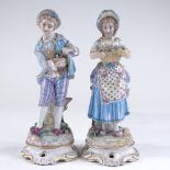 A pair of 19th century German porcelain country figures, height 28cm