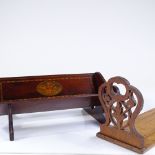 An Edwardian mahogany and marquetry inlaid book rack with inlaid fleur de lis armorial crest, length