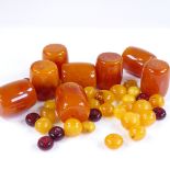Various amber beads, including butterscotch and cherry, largest length 27.8mm, 125g total