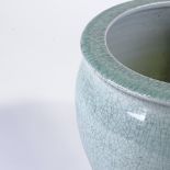 A Chinese celadon crackle glaze porcelain jardiniere, rim diameter 37cm, height 32cm