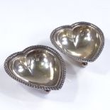 A pair of heart-shaped silver dishes, with gadrooned borders, 1 by Mappin & Webb, hallmarks London