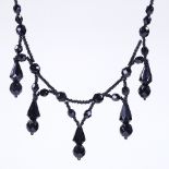 A Victorian faceted jet festoon necklace, length 39cm