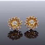 A pair of 1970s 14ct gold diamond cluster earrings, with removable central solitaire diamond ear