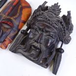 A Chinese wall mask, height 18cm, and 2 African carved wood masks (3)
