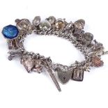 A large silver curb link heart-lock charm bracelet, with 24 charms, 94.5g