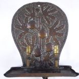 A Newlyn style Arts and Crafts copper wall light fitting, with relief fig tree decorated panel,