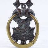 A Victorian cast-brass gurgle fish design door knocker, height 20cm