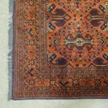 A handmade Afghan wool rug, 10' x 6'8"