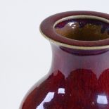 A large Chinese sang de boeuf glaze porcelain vase, wax seal mark under base, height 37cm, rim