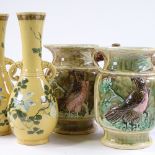 A pair of 19th century Majolica pottery jugs, with relief eagle designs, height 24cm, and a pair