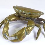 A Victorian brass inkwell in the form of a crab, with rising lid and glass well, width 19cm