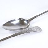 A pair of George III silver serving spoons, with bright-cut engraved handles, by Peter and Ann