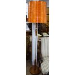 A mid-century teak standard lamp and shade