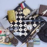 An ebony and ivory travelling games board, 1836 love token, a whistle with compass, a Thorens pocket