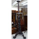 A Chinese hardwood hat stand, on a relief figural carved tripod base, H120cm