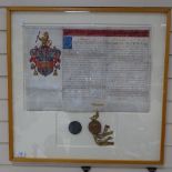 A framed written French document with coat of arms and seals, length 27" overall