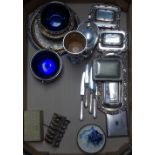 A tray containing silver-handled tea knives, plated dishes, a toast rack etc