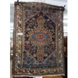 A blue ground Afghan design wool rug, 160cm x 125cm approx