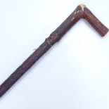A leather-covered wooden Antique sword stick, 36"