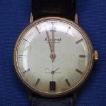 A gentleman's 9ct gold-cased Accurist wristwatch with date aperture, inscribed to the reverse 1969