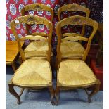 A set of 4 French oak ladder-back and rush-seated dining chairs