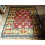 A blue and yellow ground Kilim rug, 175cm x 125cm