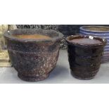 A textured terracotta garden plant pot, and a glazed plant pot (2)