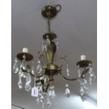 A modern 3-branch chandelier with lustre drops