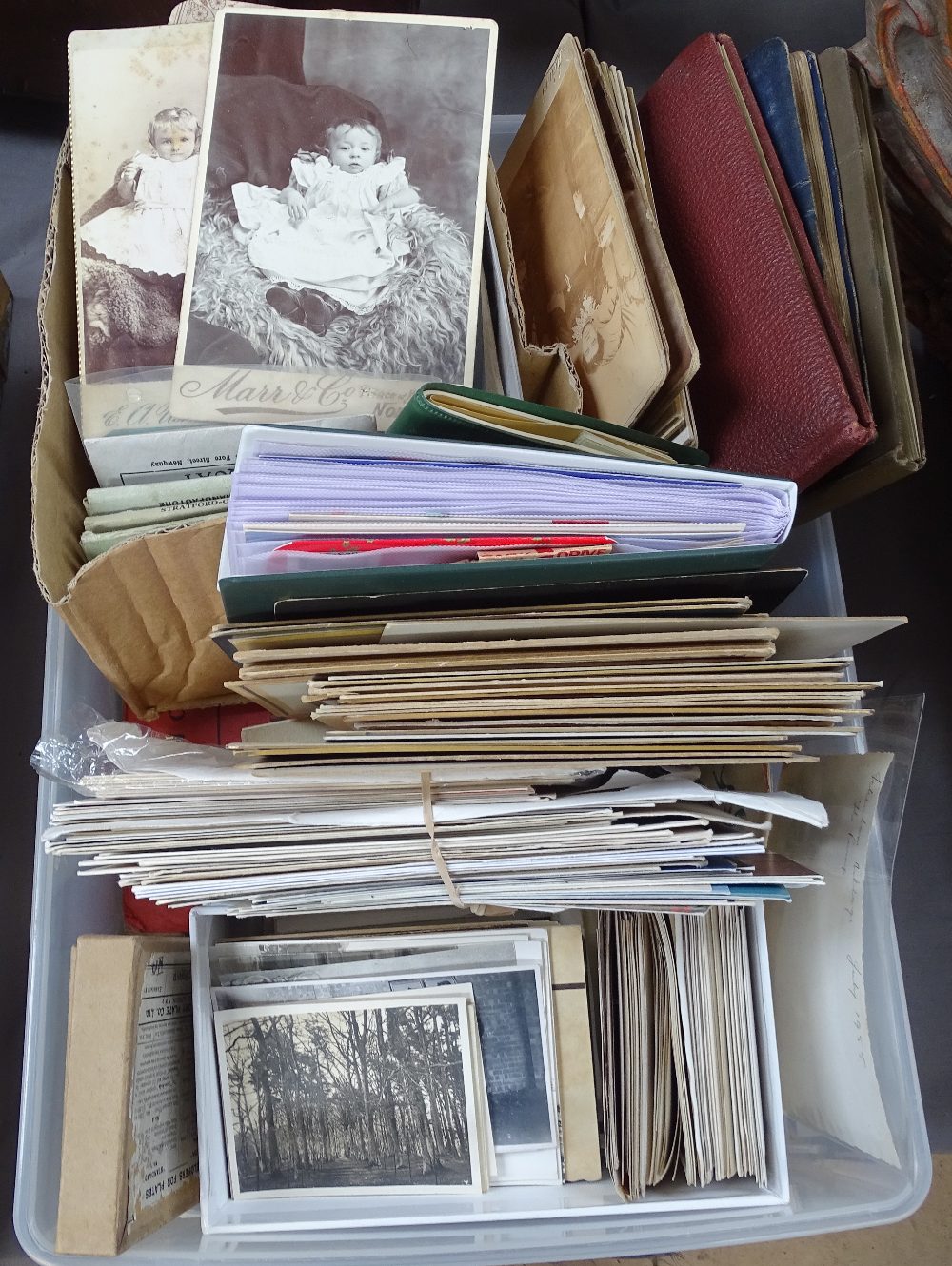 A tray of ephemera relating to smoking, postal and cabinet photos etc