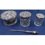 3 silver-topped dressing table jars, and a silver-handled button-hook