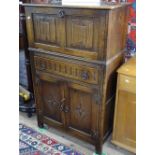 An oak cocktail cabinet with linenfold carved panels, W75cm