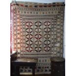 A needlework Sumak Kilim rug, 182cm x 131cm