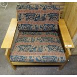 A Danish oak armchair with loose cushions