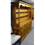 A large modern polished pine 2-section kitchen dresser, L183cm, H195cm