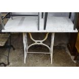 A rectangular marble-top garden table on scrolled wrought-iron base, W110cm