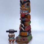 A carved and painted Canadian Native totem, 22", and a small figure