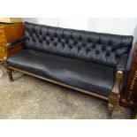 A Victorian carved mahogany-framed settee, on turned legs, L175cm