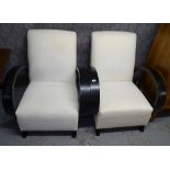 A pair of Art Deco style armchairs with exaggerated bentwood arms