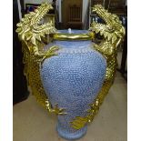 An Oriental design painted terracotta baluster vase, with ornate gilded applied dragon decoration,
